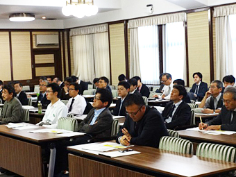 Participants listening to the presentations