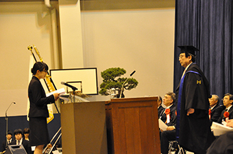 A student representative delivering a statement at the graduate student entrance ceremony