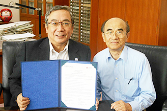 President Mishima and Professor Ichimura with the signed agreement