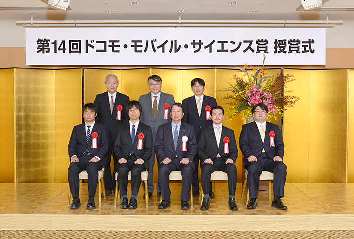 Photo of the award ceremony (In the front row, 2nd from the left, is Associate Professor Kawano)