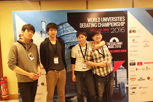 From left: Heishiro Kanagawa, Yusuke Yonezawa, Shintaro Kaiho, and Masahiro Hayashi at WUDC Opening Ceremony (photo courtesy of Daisuke Ujiie)