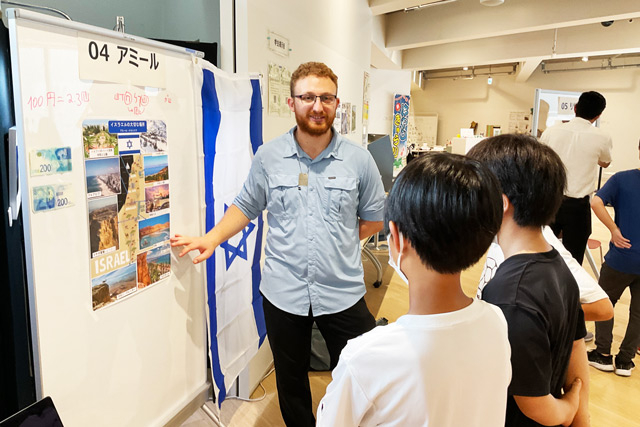 Another student using flag and banknotes during his talk