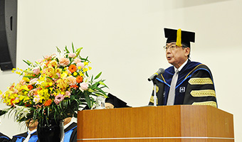 President Yoshinao Mishima giving his opening address