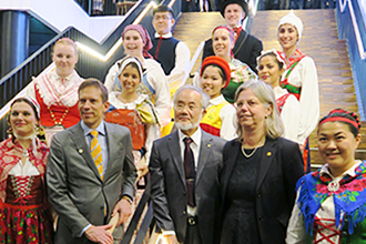 Group photo with people in traditional costume
