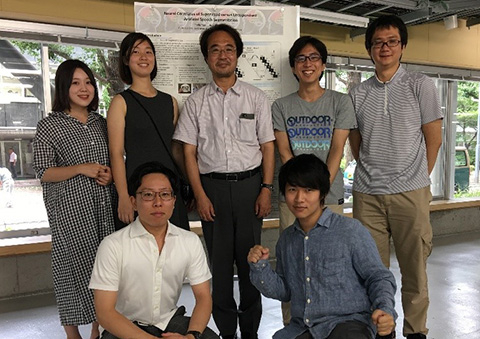 Yuan and Akama (back row, second and third from left) with host lab members during final poster presentation