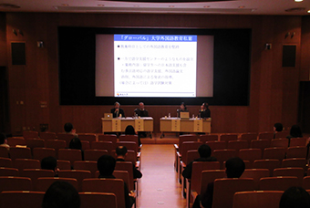 Three distinguished professors discussing foreign language education