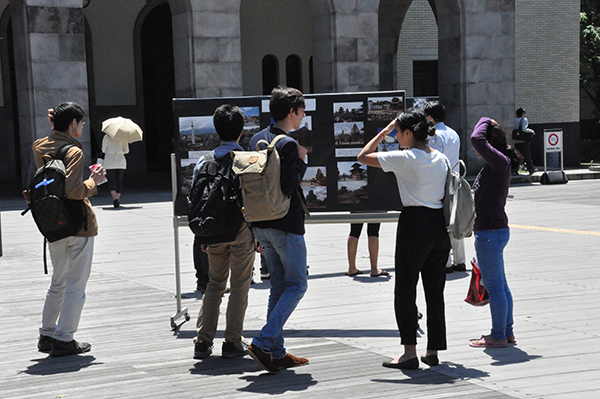 Students stopping to view the pictures