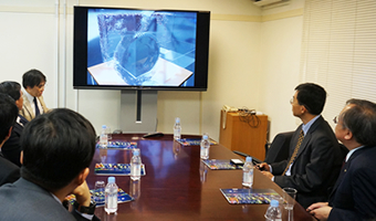 Presentation by GSIC Vice Director Aoki (far left)