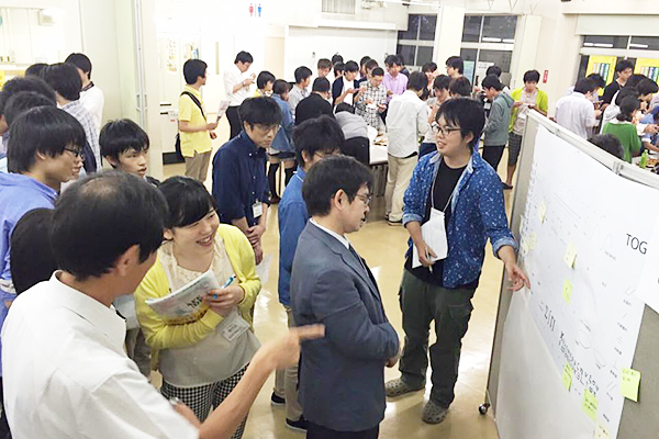 Student presenting the project at Tokyo Tech University Co-op meeting of shareholders' representatives
