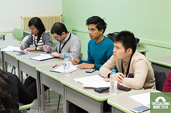 Preliminary heat speeches (left) and Tokyo Tech's Daisuke Ujiie (seated far right) participating as one of the judges (photo courtesy of WUDC 2016)
