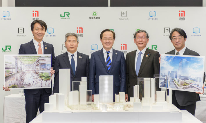Tokyo Tech President Kazuya Masu (center) with representatives of partner companies joining Tamachi Campus redevelopment