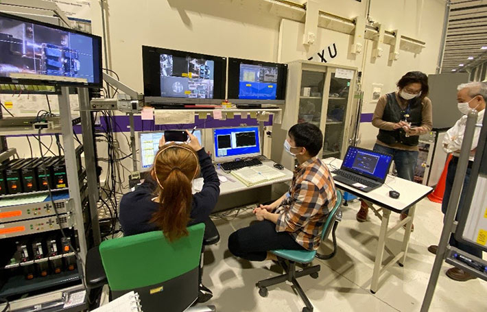 Cody (seated on right) at SPring-8, surrounded by computers for 48 hours