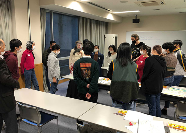 Participants taking closer look at each student's sketch