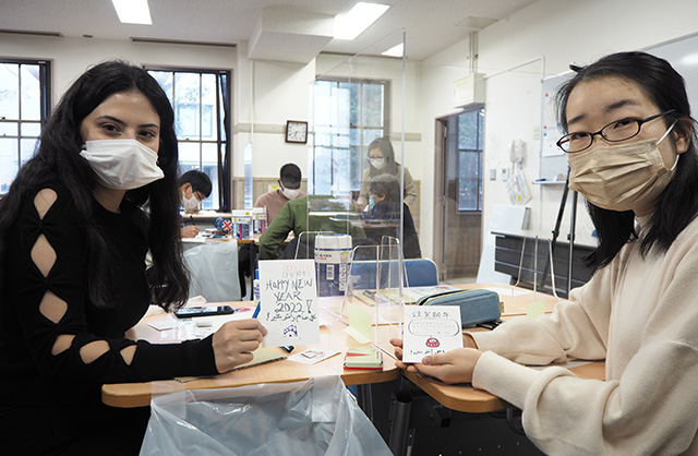 Participants displaying their completed New Year's cards