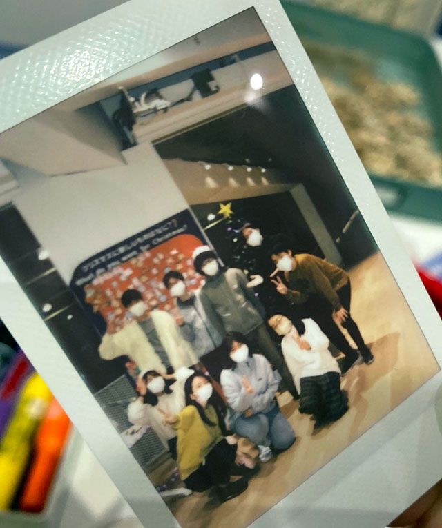 Participants having fun with instant camera
