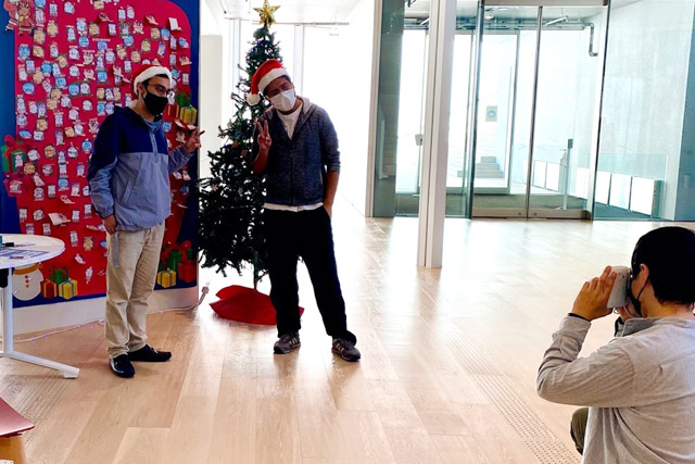 Two international students with their Santa poses