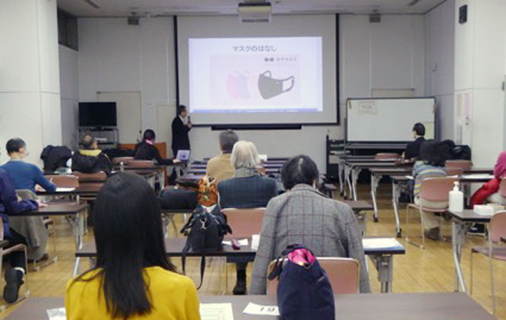 Audience listening closely to latest information on cutting-edge masks