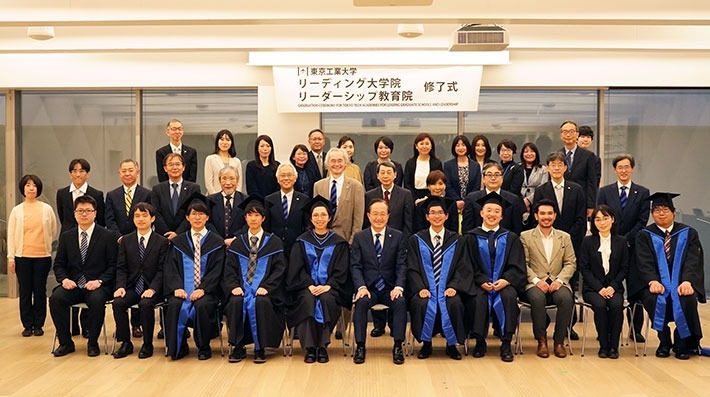 Commemorative photo of program graduates, faculty, staff