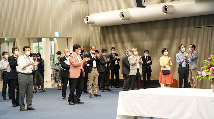 Participants enjoying evening reception after three-year break