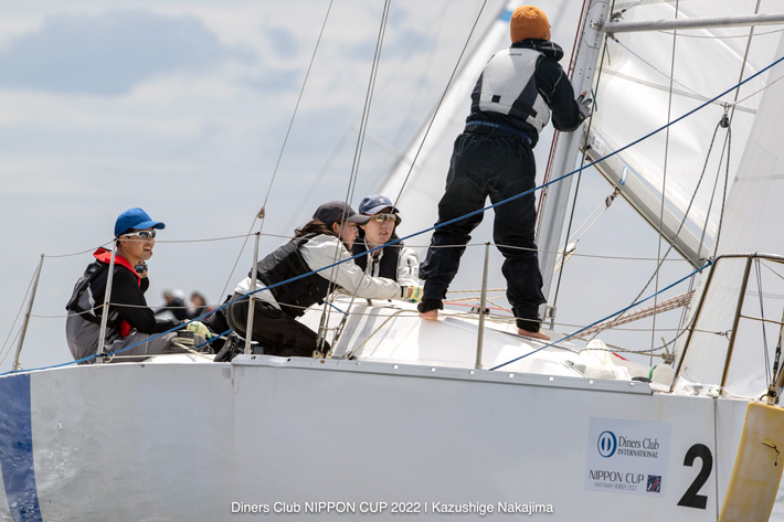 (from left) Yokoyama, Sato, Hagiuda, Horie rounding windward mark in first position