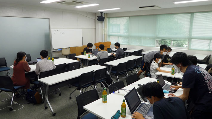 Participant groups working on code together