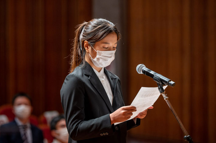 Student representative Han giving statement