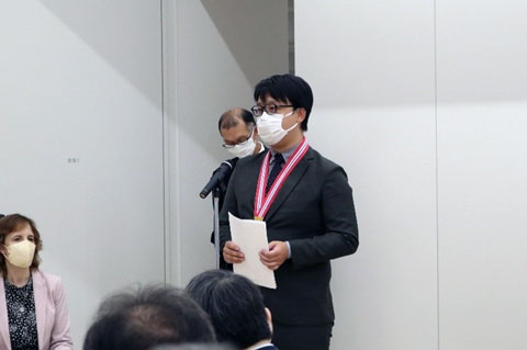 TAC-MI Graduate Hao giving speech