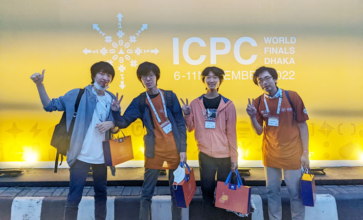 Team good_yamikin (from left): Matsuura, Yoshida, Yamagata, team coach and Assistant Professor Yoshiki Nakamura