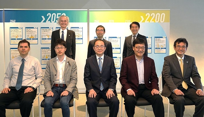 DLab Research Grant 2023 recipients (front left) Assoc. Prof. Manzhos, Assoc. Prof. Ehara, Assoc. Prof. Kato, Prof. Ueda, Prof. Umemuro, (back left) DLab Director Isao Satoh, Assoc. Prof. Hata, DLab Assoc. Director Naoto Ohtake