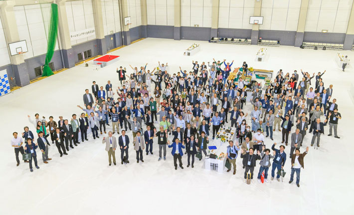 Group photo of participants at evening reception