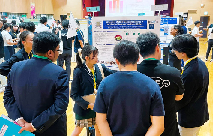 Members in action during poster presentation
