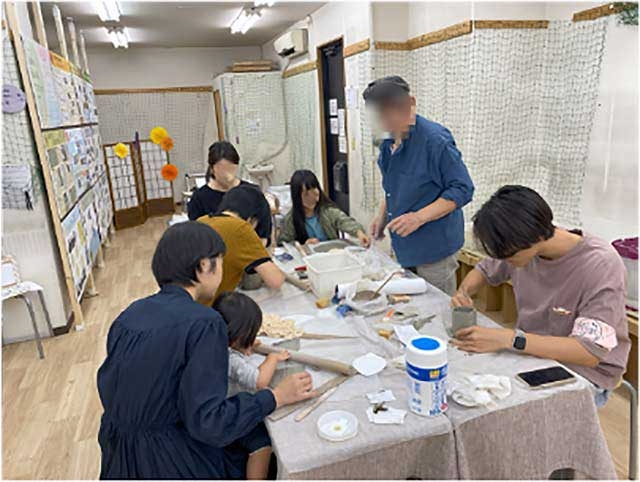 Pottery experience involving community members