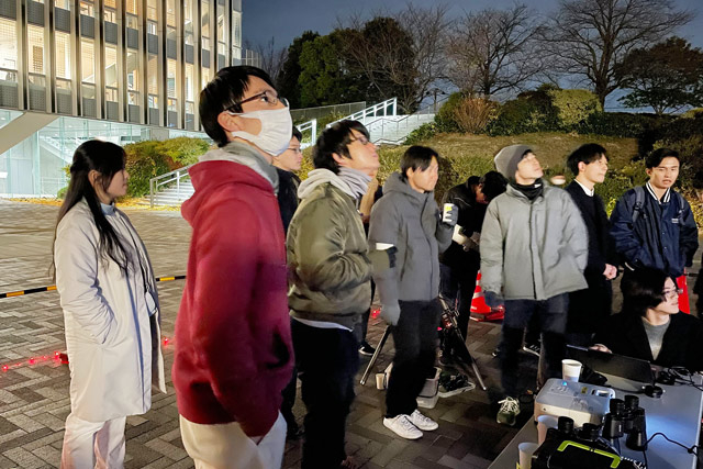 Participants listening to presentation of observed celestial bodies