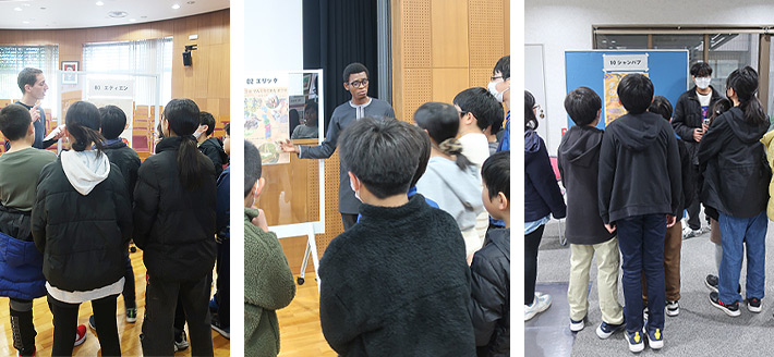 International students explaining poster content to elementary school students