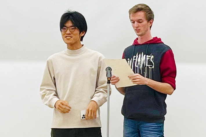 Participants on stage performing original manzai