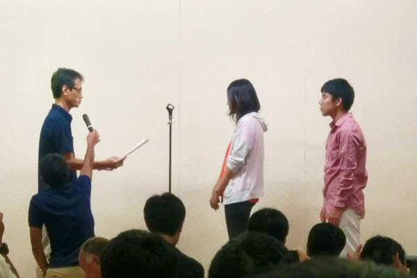 CREATE President Naoko Kitai (center) and Project Manager Wataru Nakagome (right) receiving MHI award