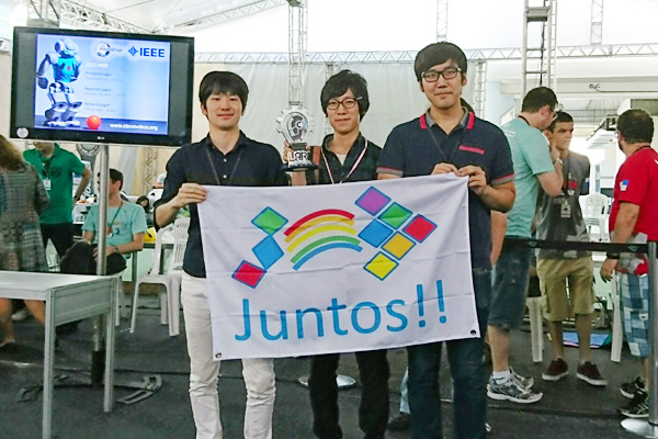 Team Tokyo Tech members (from left) Shirie, Takano, and Chang at awards ceremony