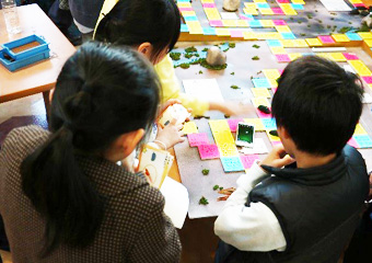 Children trying out groups' creations