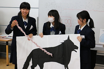 Younger generations testing out materials that high schoolers presented at their booths