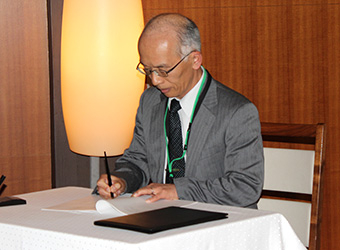 Dean Okada at signing ceremony