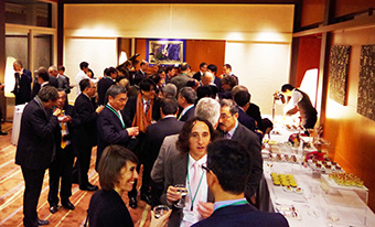 Participants enjoying pleasant discussions at cocktail party