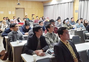 Participants listening to presentation