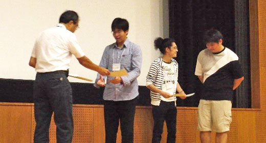 Executive Vice President Ando presenting awards