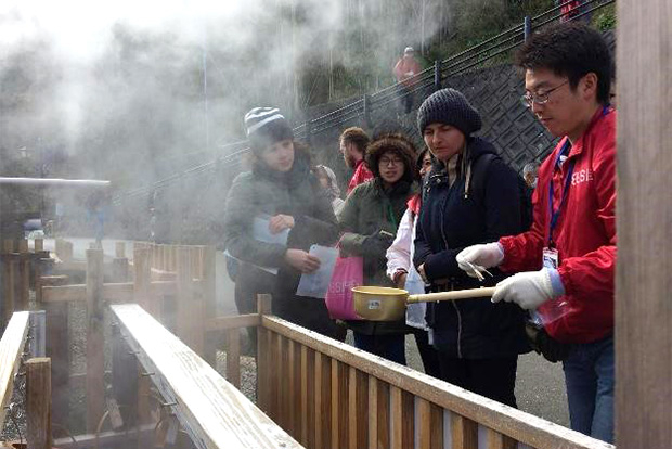 Taking microbial samples from the hot spring at Mine Onsen. Photo courtesy of Kazumi Yoshiya.
