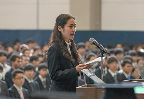 Representative for master's and doctoral students delivering a statement