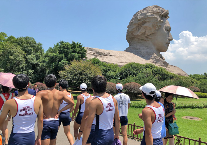 Rowing Club members exploring near Young Mao Zedong statue in Changsha