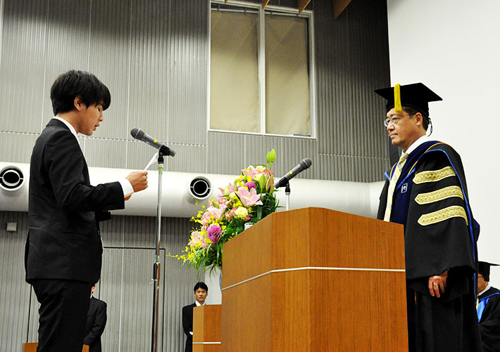 Student representative Putra (left) giving his speech