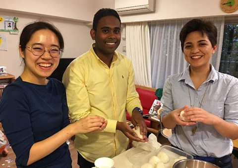 (from left) Ito, Sobha, and Goodman make rice balls