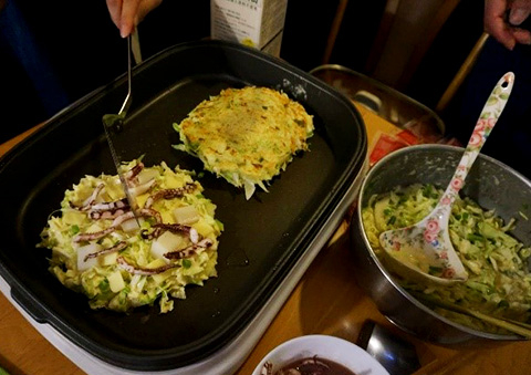 Cooking okonomiyaki, a popular Japanese dish