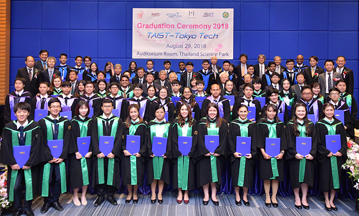 TAIST graduates with program faculty members